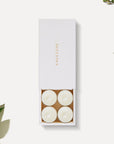 Vaucluse jasmine scented white tealight candles arranged in a luxury sliding white gift box with gold logo detailing