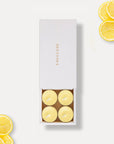 Vaucluse Lemon scented tealight candles in minimalist luxury packaging.