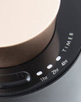 A detailed close-up shot of the black control panel ring on the diffuser, highlighting the touch timer indicator lights for 1hr, 2hr, and 4hr.