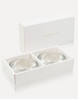Two premium clear glass tealight candle holders safely displayed inside an open minimalist luxury white gift box featuring gold Vaucluse branding.