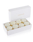 An open white Vaucluse luxury gift box displaying a set of clear cup vanilla scented tealight candles.