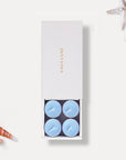 Vaucluse Zephyr scented tealight candles in minimalist luxury packaging.