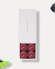 Vaucluse Blackberry scented tealight candles in a premium white slide-out gift box.
