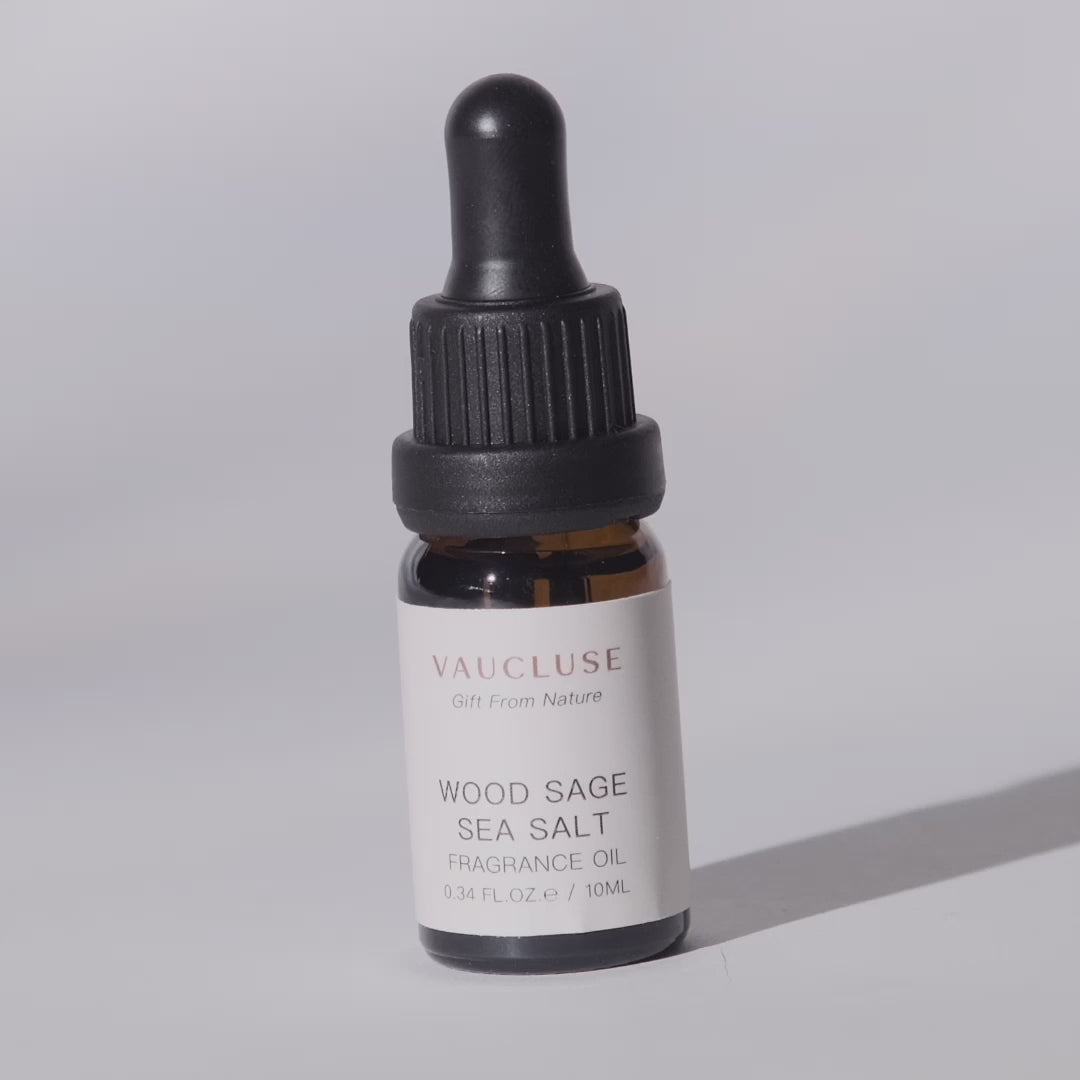 A video thumbnail displaying a 10ml amber glass bottle of Vaucluse Wood Sage Sea Salt Essential Oil fitted with an integrated black rubber bulb dropper top.