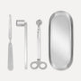 Premium silver candle care accessory set featuring a stainless steel wick trimmer, candle snuffer, wick dipper, and matching oval tray on a clean background.