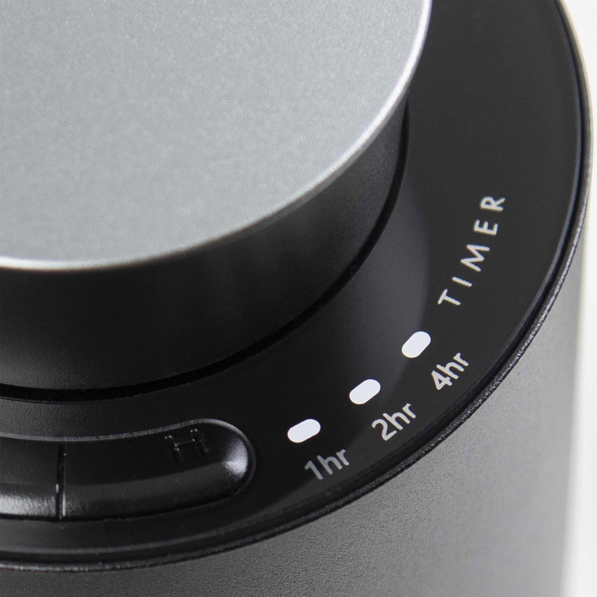 A detailed close-up of the black glass touch control panel on the diffuser showing integrated timer settings for 1hr, 2hr, and 4hr modes.