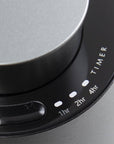 A detailed close-up of the black glass touch control panel on the diffuser showing integrated timer settings for 1hr, 2hr, and 4hr modes.