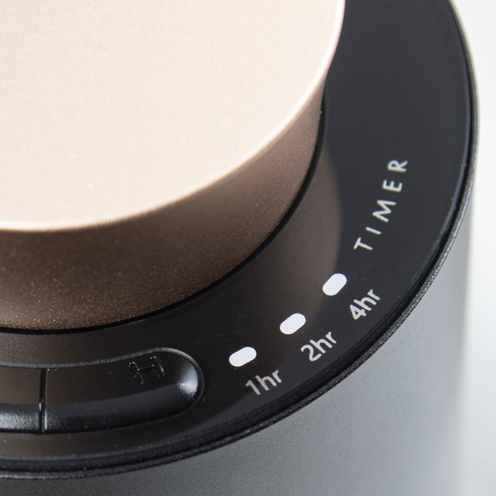 A detailed close-up shot of the black control panel ring on the diffuser, highlighting the touch timer indicator lights for 1hr, 2hr, and 4hr.
