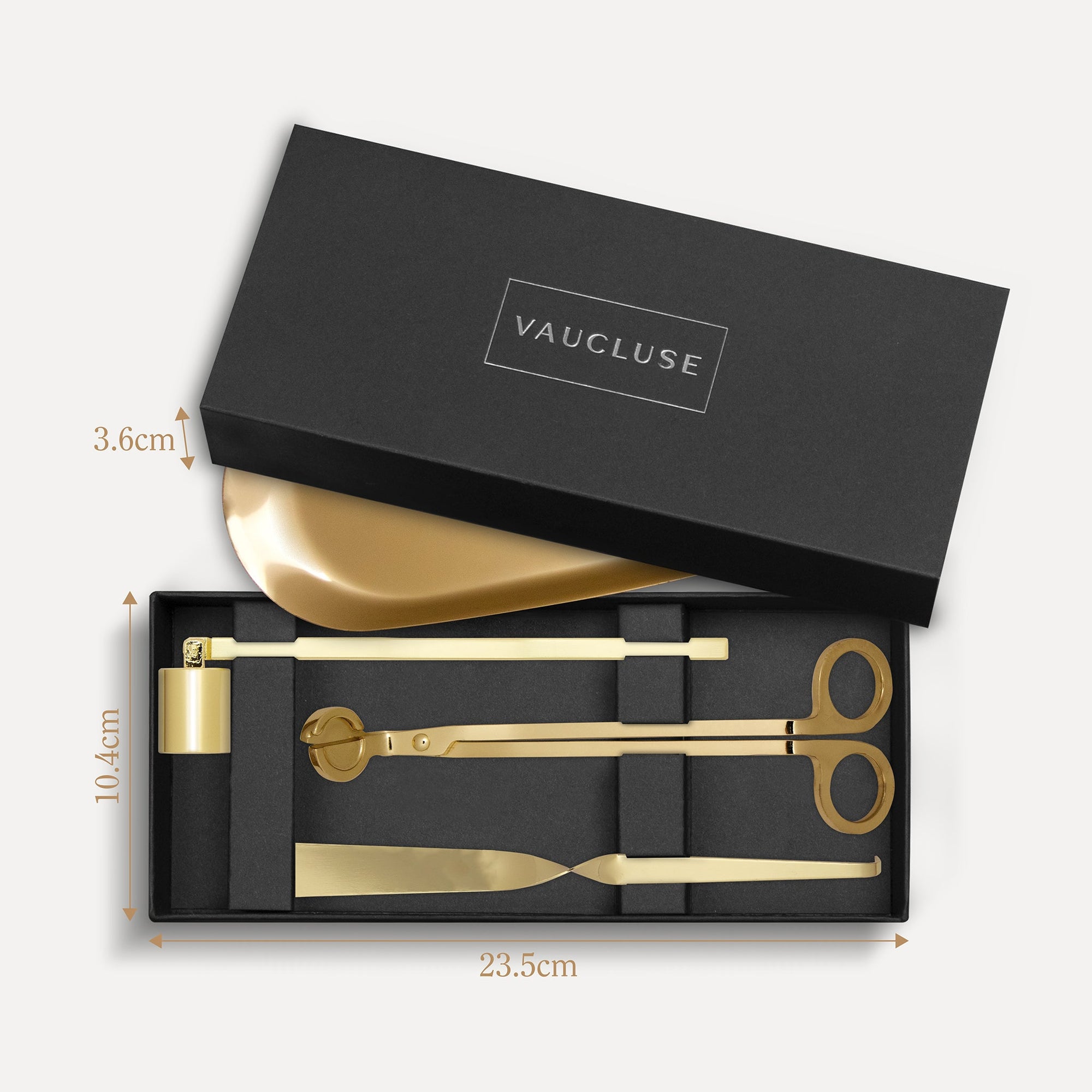 Vaucluse Fragrance luxury black gift box packaging revealing a gold candle trimmer tool set with labeled dimensions.