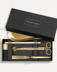Vaucluse Fragrance luxury black gift box packaging revealing a gold candle trimmer tool set with labeled dimensions.
