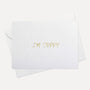 Front view of a minimalist white Vaucluse "I'm Sorry" apology greeting card resting on its matching white paper envelope.