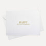 Front flat lay view of a minimalist luxury white housewarming card featuring elegant gold text reading Happy House Warming, displayed with its matching white envelope.