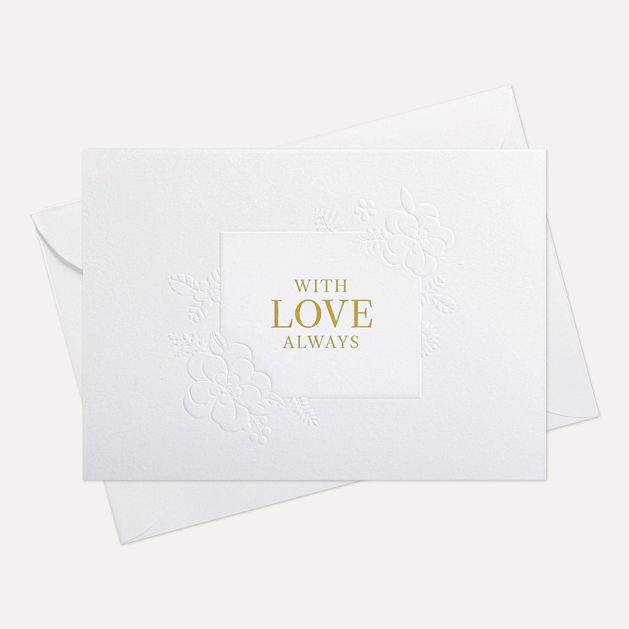 Overhead view of a minimalist luxury white romantic greeting card featuring gold foil text reading With Love Always, displayed with its matching envelope.