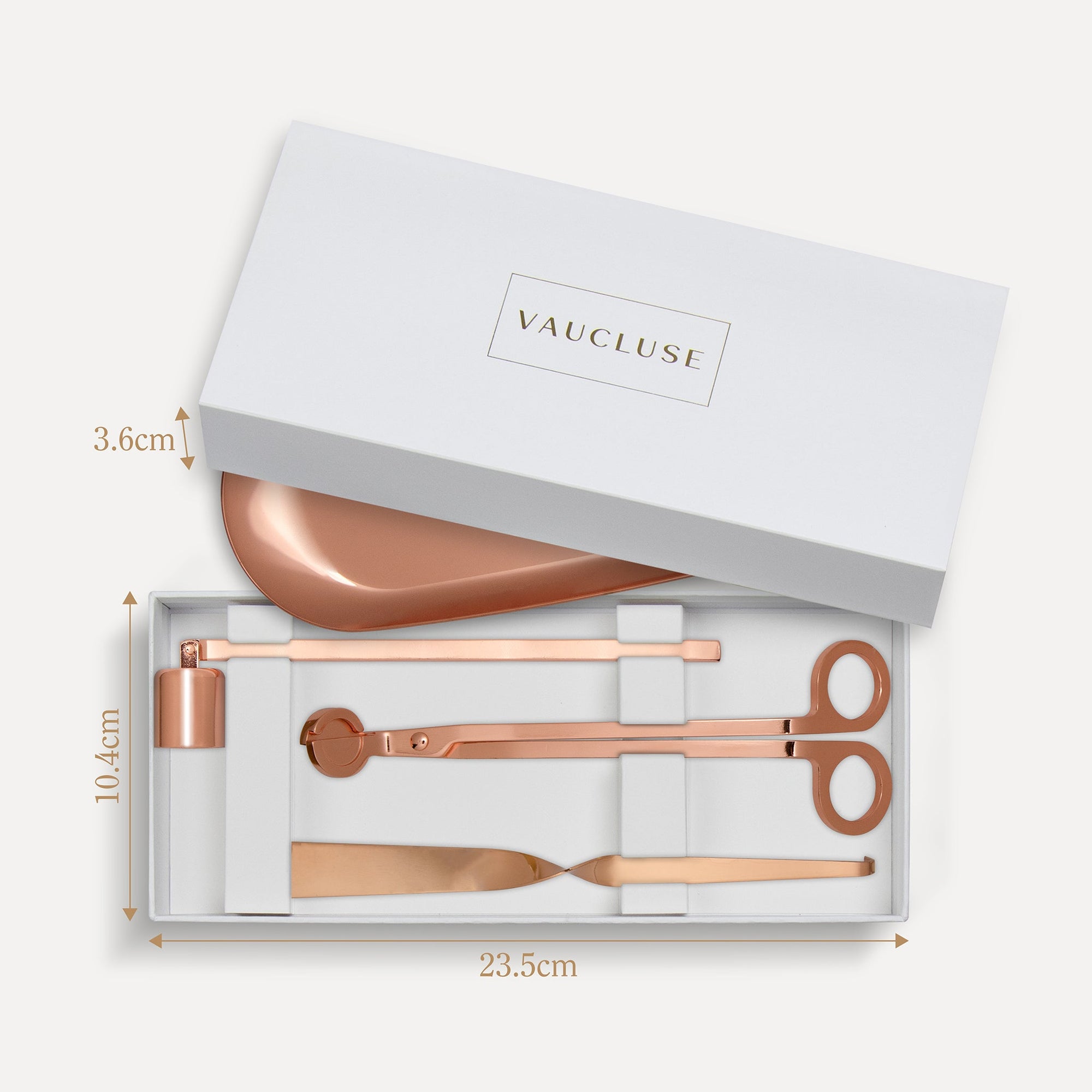 Vaucluse Fragrance luxury white gift box packaging revealing a rose gold candle trimmer tool set with labeled dimensions.