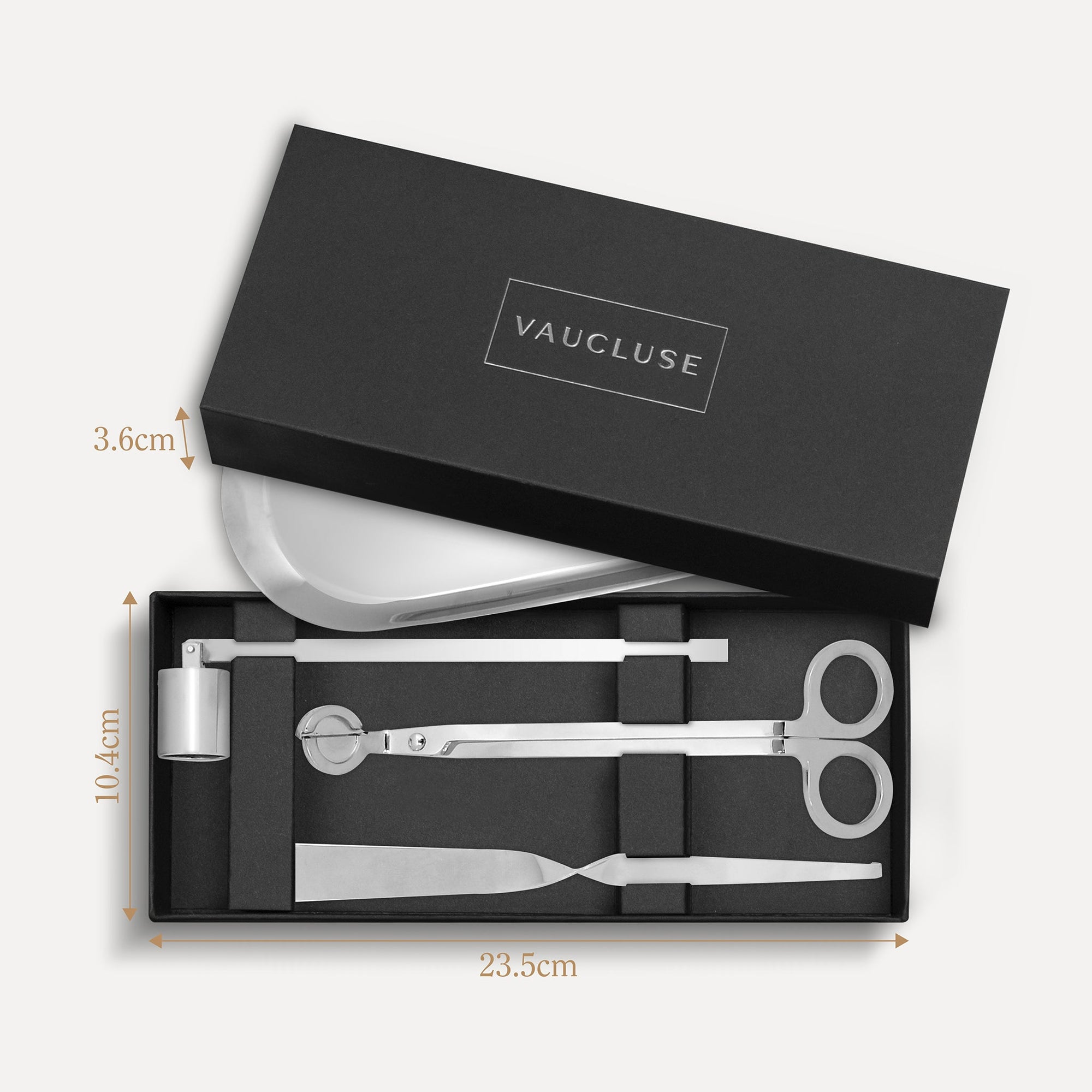 Vaucluse Fragrance luxury black gift box packaging revealing a silver candle trimmer tool set with labeled dimensions.