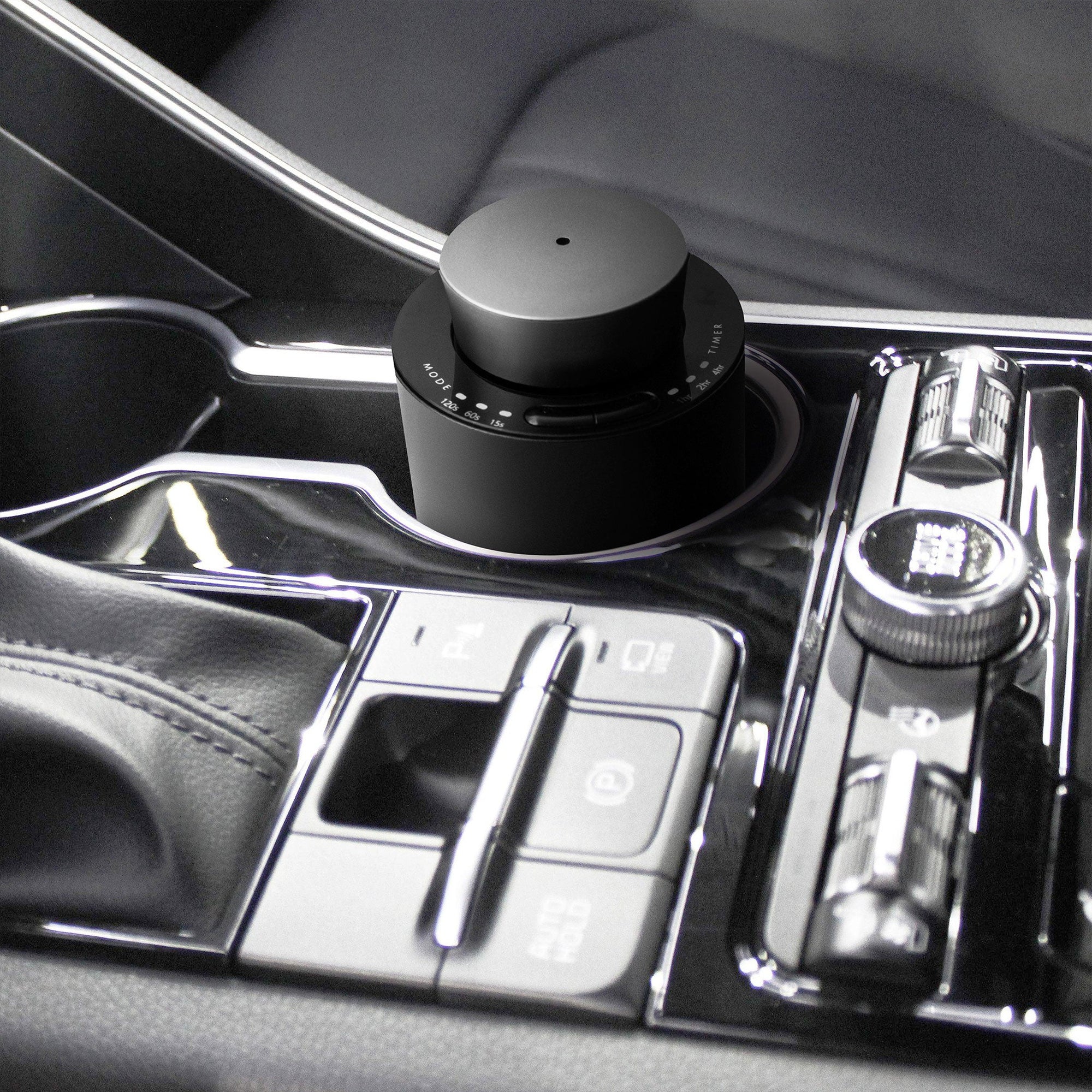 A close-up view of the touch-sensitive black glass control panel on the gun metal diffuser showing the 1hr, 2hr, and 4hr timer option indicators.