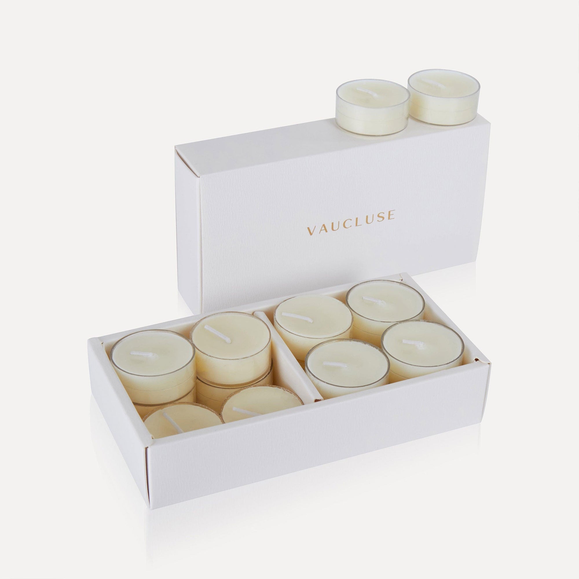 An open box of Vaucluse Jasmine scented tealight candles showing a premium white presentation pack filled with white soy tealights.