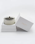 A Vaucluse Black Rose scented candle resting inside its custom white, two-piece premium gift box with the lid elegantly propped open.