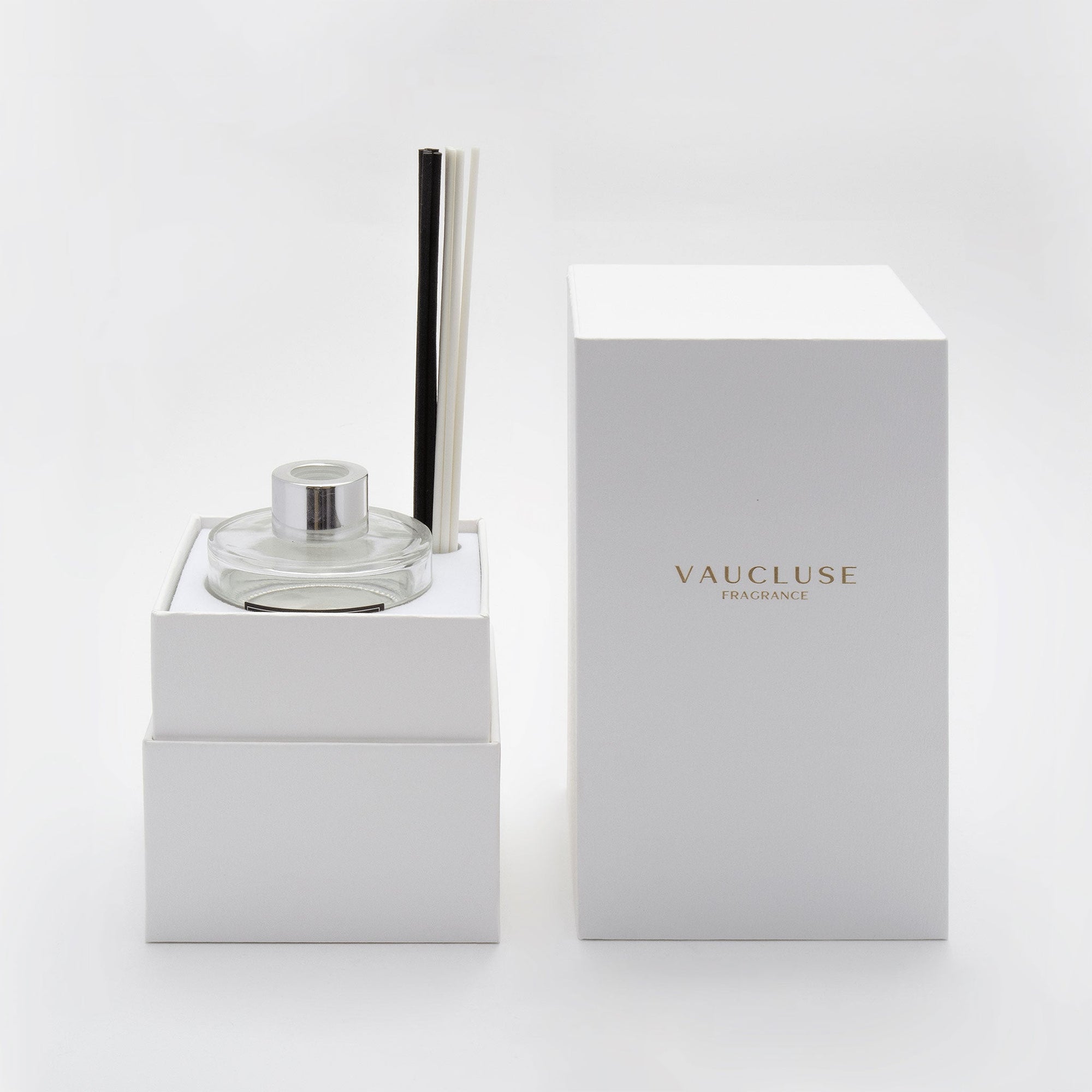A premium white Vaucluse presentation box unboxed to reveal the secure, multi-tier interior layout designed to elegantly protect the glass diffuser bottle and components.