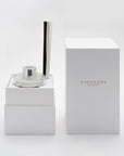 A premium white Vaucluse presentation box unboxed to reveal the secure, multi-tier interior layout designed to elegantly protect the glass diffuser bottle and components.