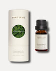 A 10ml bottle of Vaucluse Peppermint Essential Oil standing next to its premium cream-colored cylindrical cardboard packaging tube.