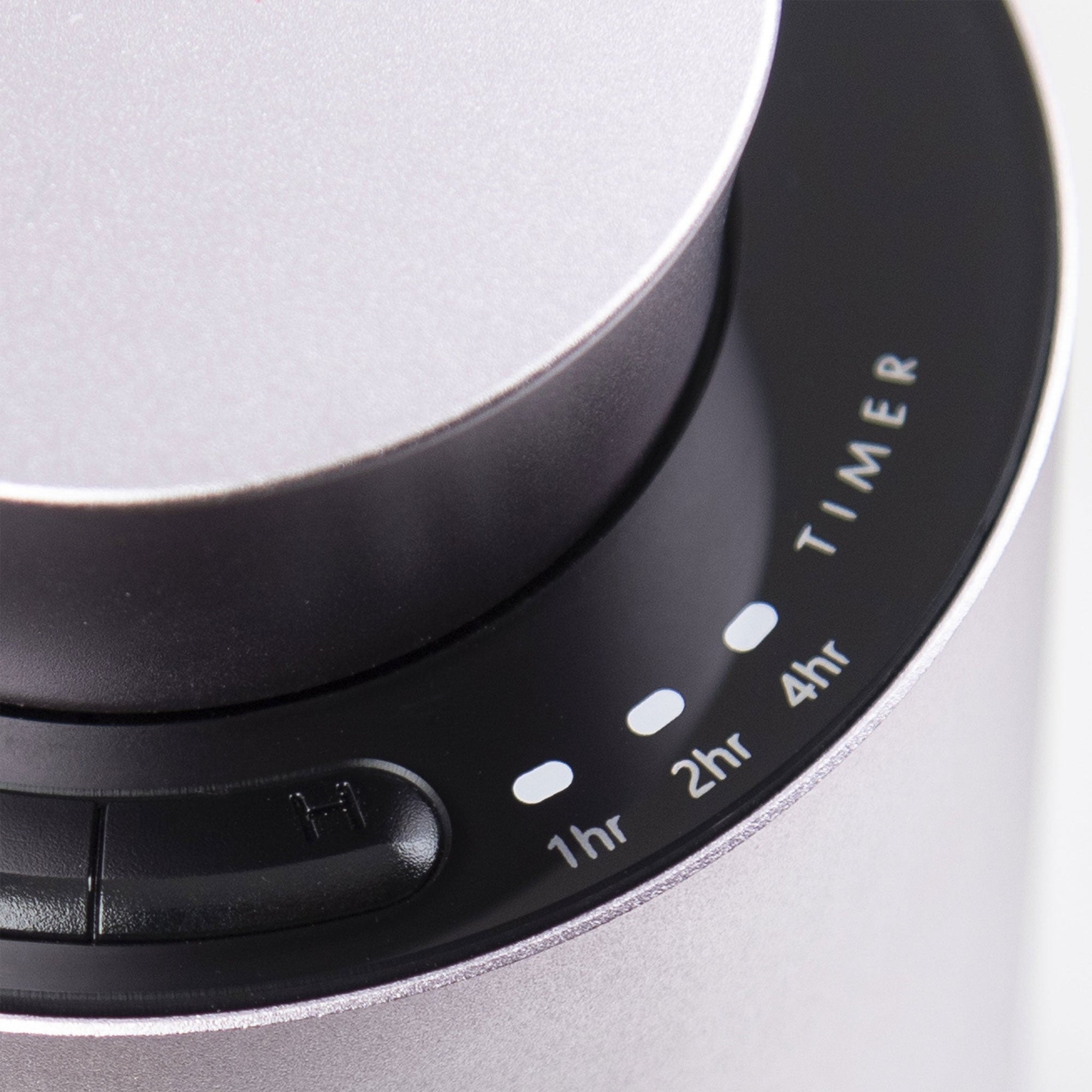 A close-up shot of the touch-sensitive black glass control interface on the purple dusk diffuser highlighting the 1hr, 2hr, and 4hr timer indicators.