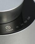 A close-up shot of the touch-sensitive control panel on the silver diffuser, showing the custom timer intervals for 1H, 4H, 12H, and Car mode.